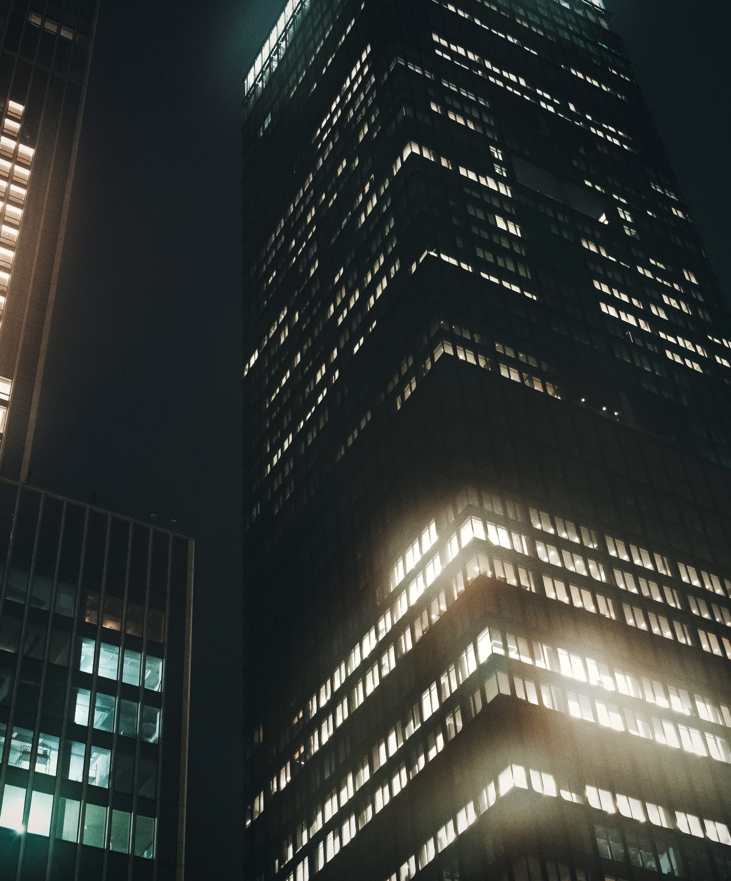 Office towers lit at night